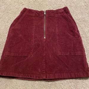 Red velvet mini skirt with zipper and pockets
